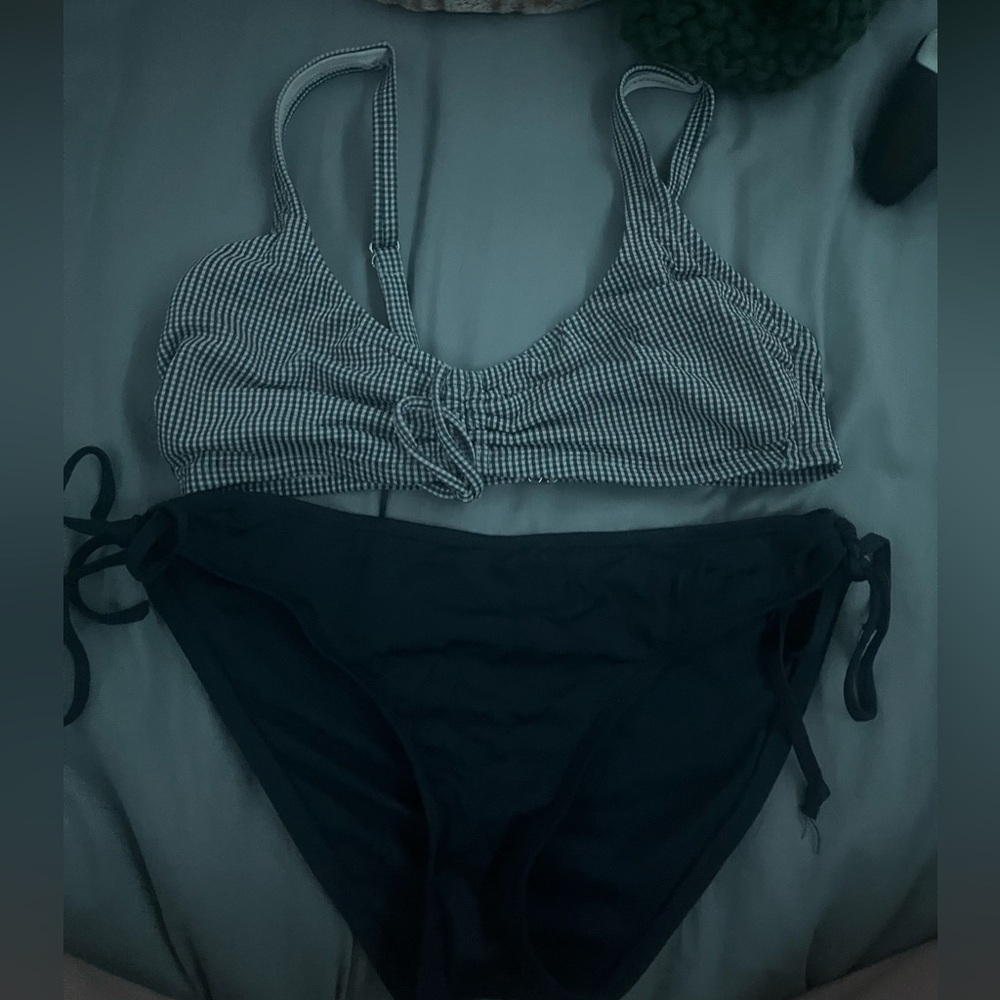 two piece matching bikini. navy bottoms and a navy blue plaid top